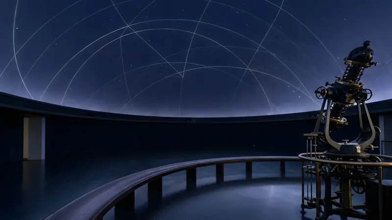 A star projector under a ruled dome at blue hour.